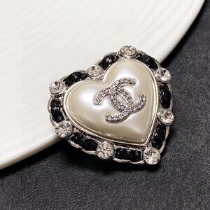 CHANEL's new silver black leather heart brooch is the most